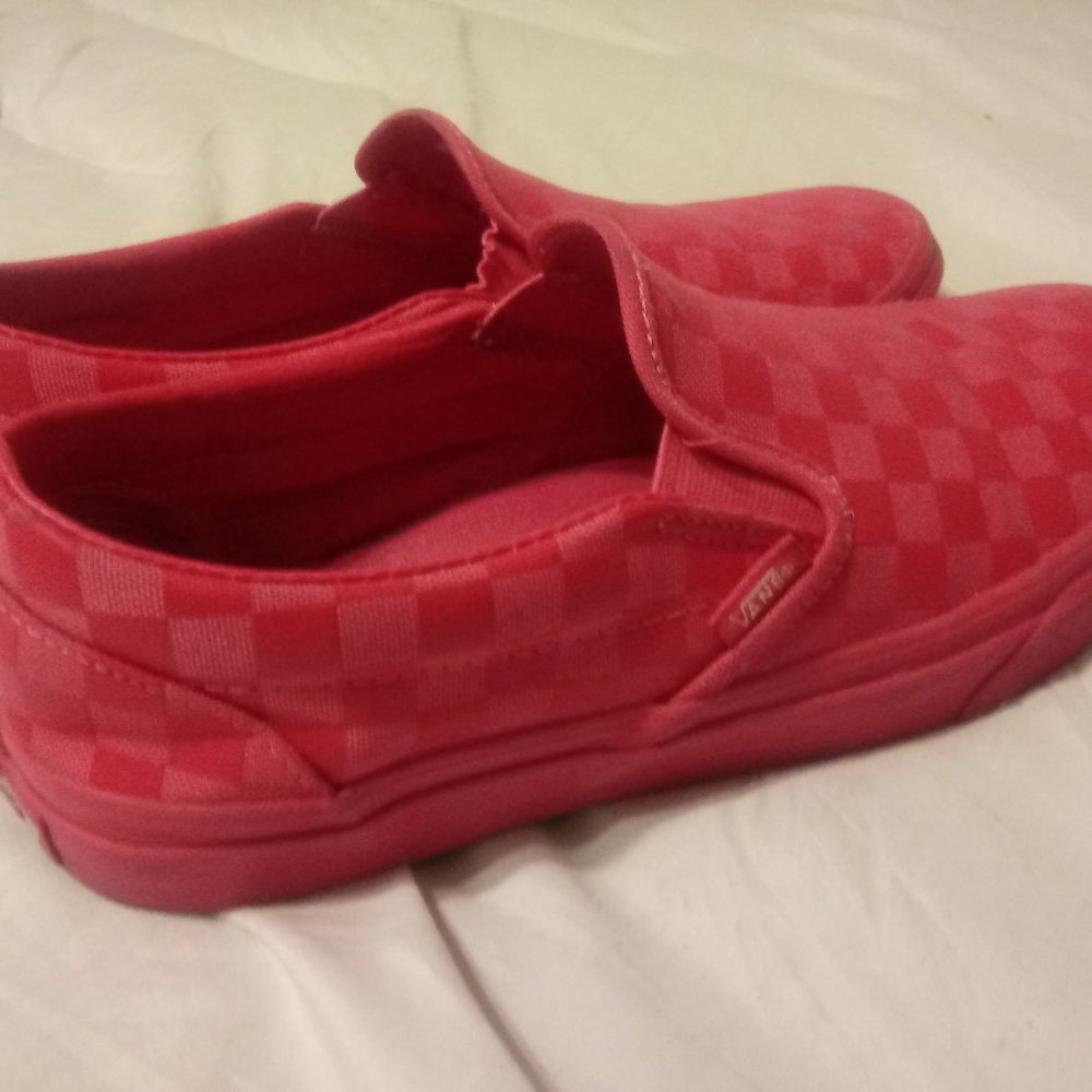 Hot pink Vans slip-on sneakers